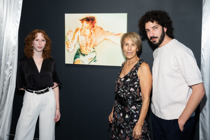 Artist posing in front of their work with Bonnie Clearwater